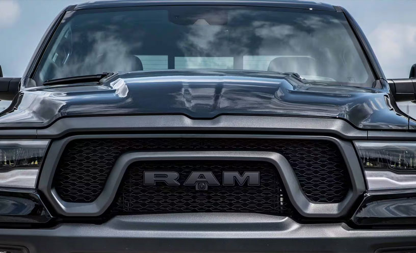 A head-on view of the 2023 Ram 1500, focusing on the grille and headlamps.
